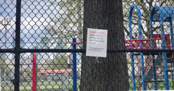 A Philadelphia playground sign says it is closed because of COVID-19
